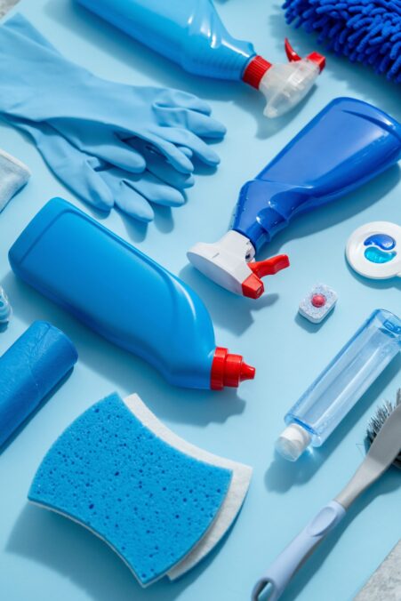 Colorful,Cleaning,Products,On,Plain,Blue,Background.,Housecleaning,Concept